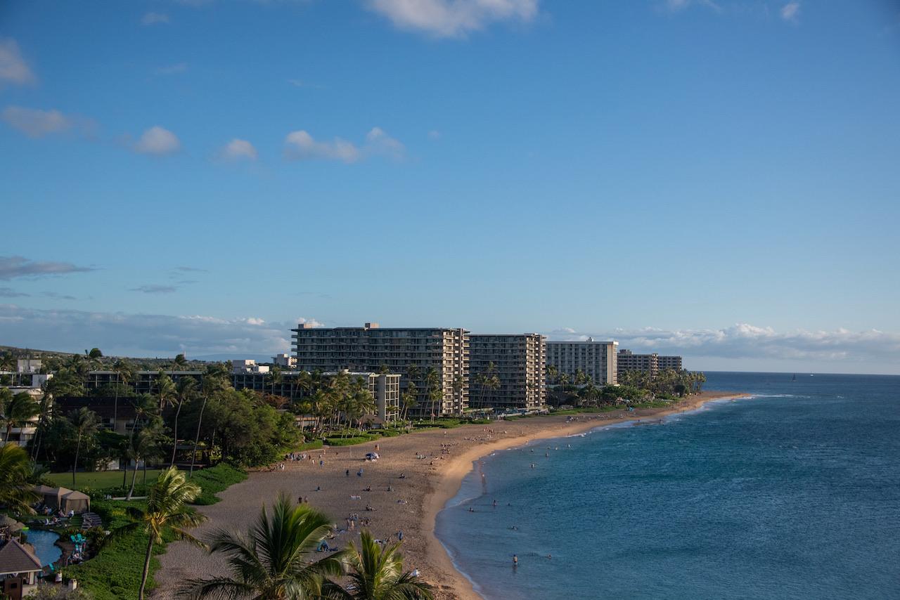 Kaanapali Beach curving toward Black Rock, seen from above on a clear afternoon